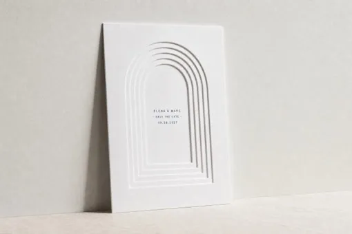 Visualisation: concentric arches pressed in stepped relief into heavy white paper, with the names printed at the centre.